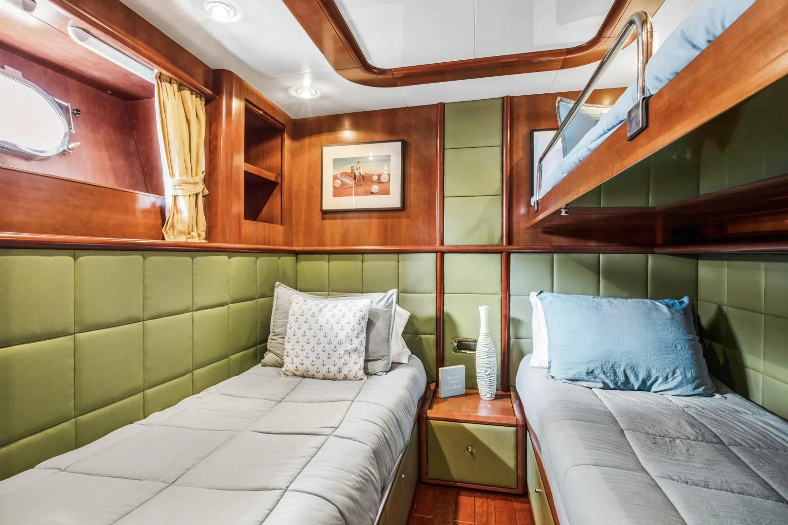 a room with a bed and a mirror aboard ALCHEMY Yacht for Sale