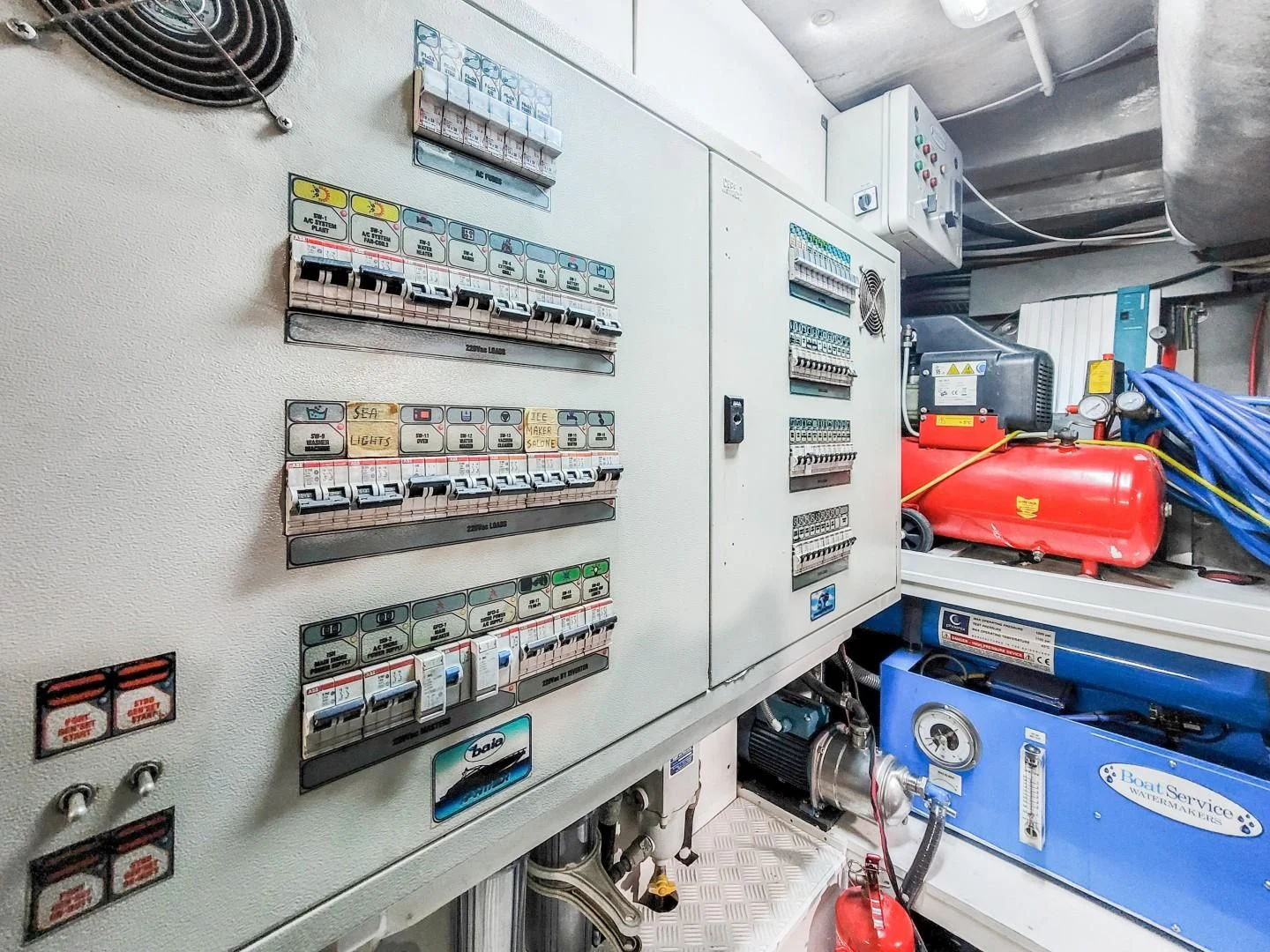 a white control panel with a few signs and other objects aboard ALCHEMY Yacht for Sale