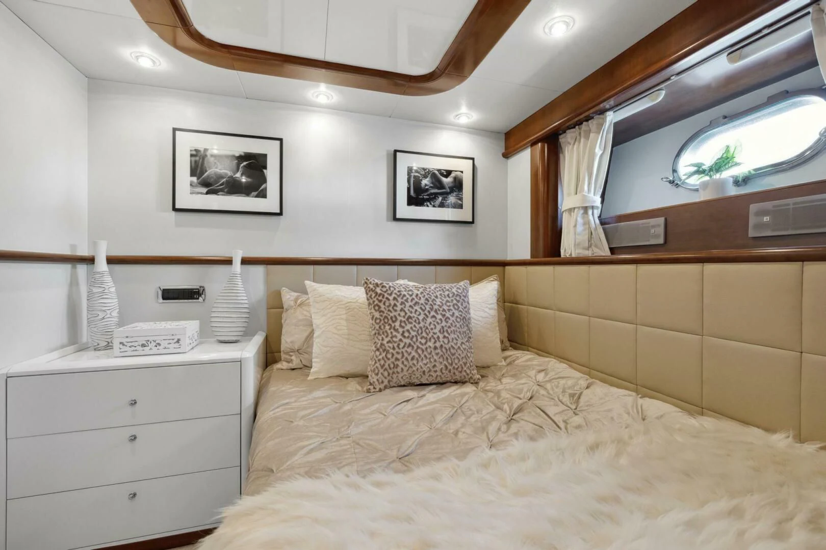 a bed with a white bed spread aboard ALCHEMY Yacht for Sale