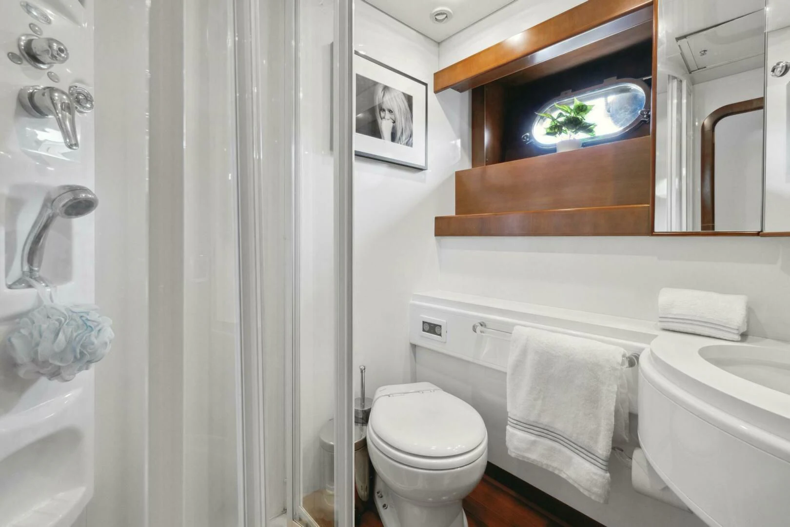 a bathroom with a toilet and a sink aboard ALCHEMY Yacht for Sale