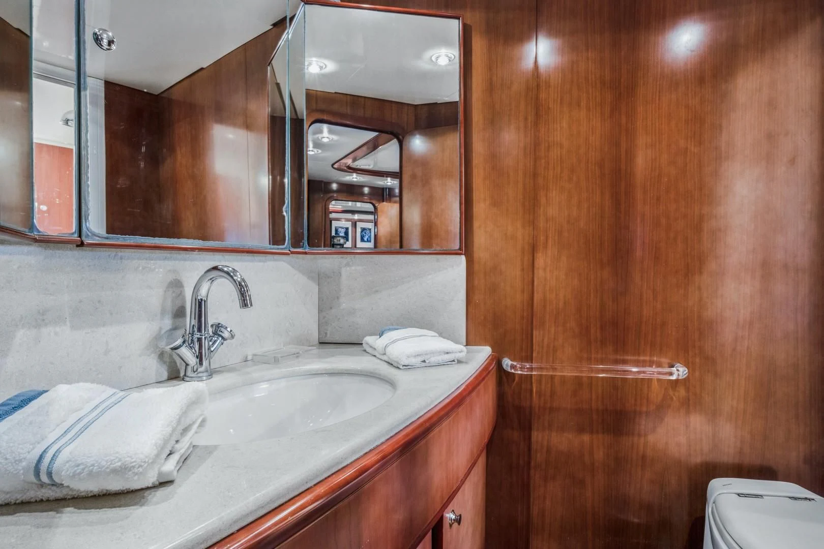a bathroom with a mirror and a sink aboard ALCHEMY Yacht for Sale