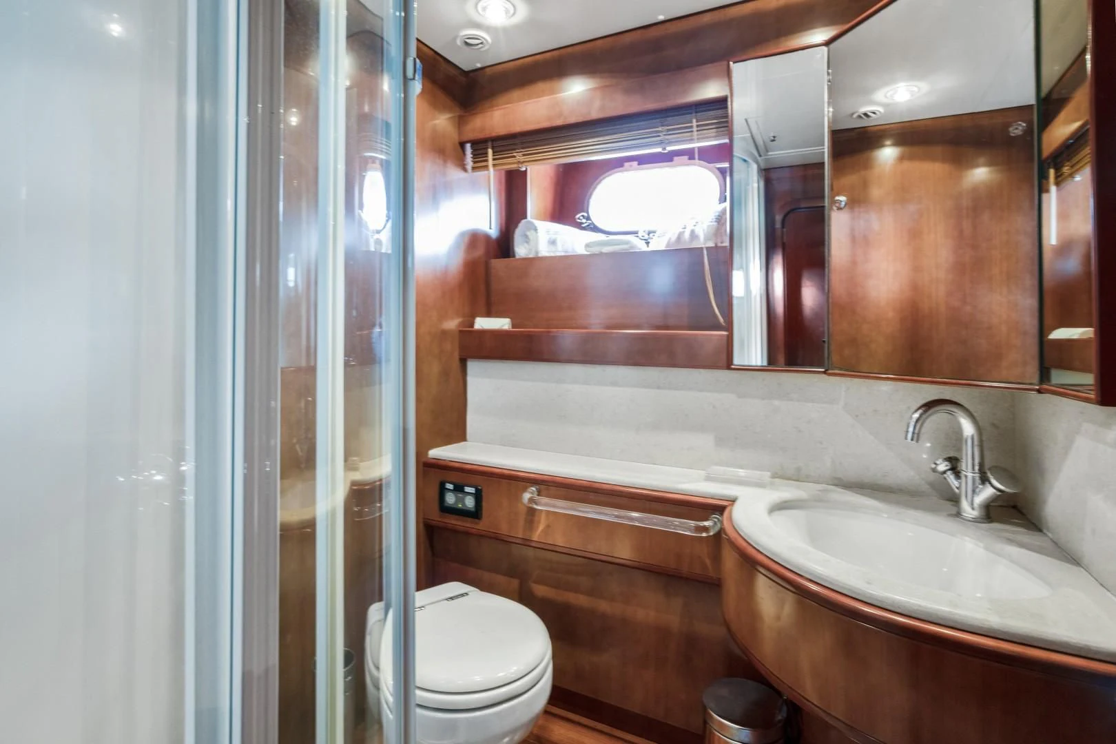 a bathroom with a glass shower aboard ALCHEMY Yacht for Sale