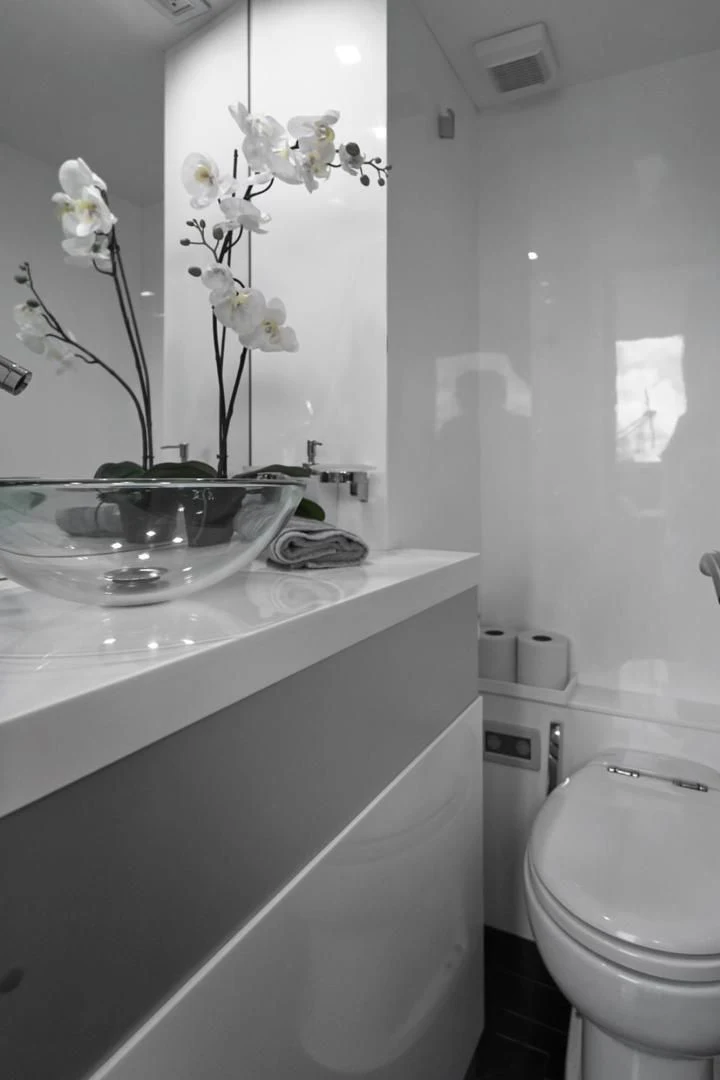 a bathroom with a sink and toilet aboard EL PATRON Yacht for Sale