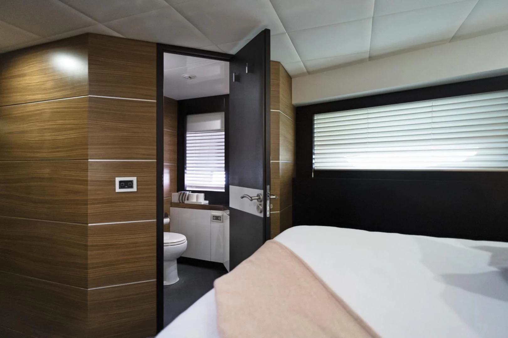 a bathroom with a tub and a sink aboard EL PATRON Yacht for Sale