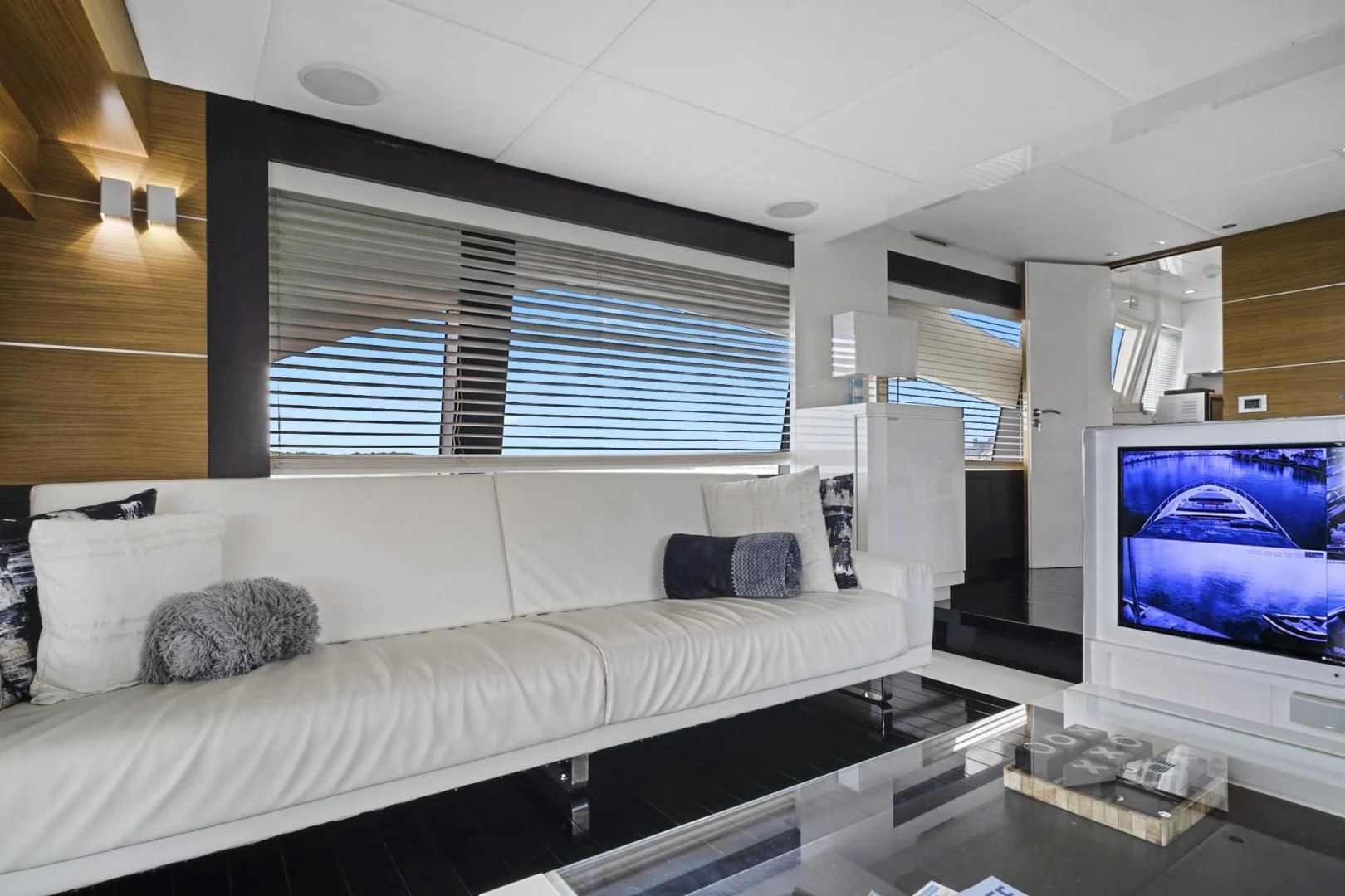 a living room with a large window aboard EL PATRON Yacht for Sale