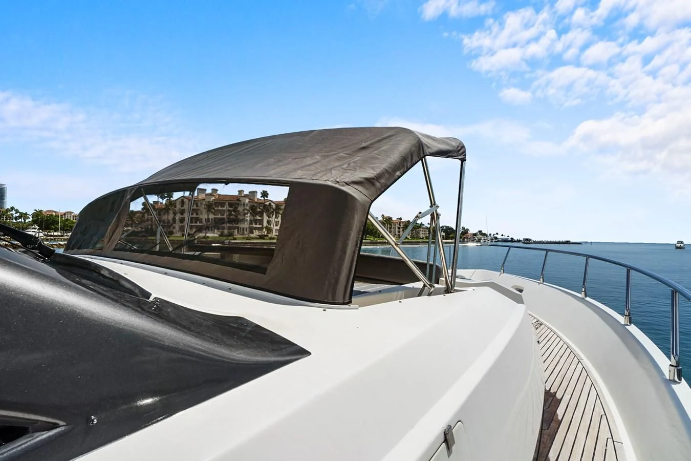 a side view of a car with a side mirror aboard EL PATRON Yacht for Sale