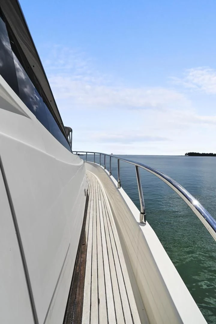 a long white boat on water aboard EL PATRON Yacht for Sale