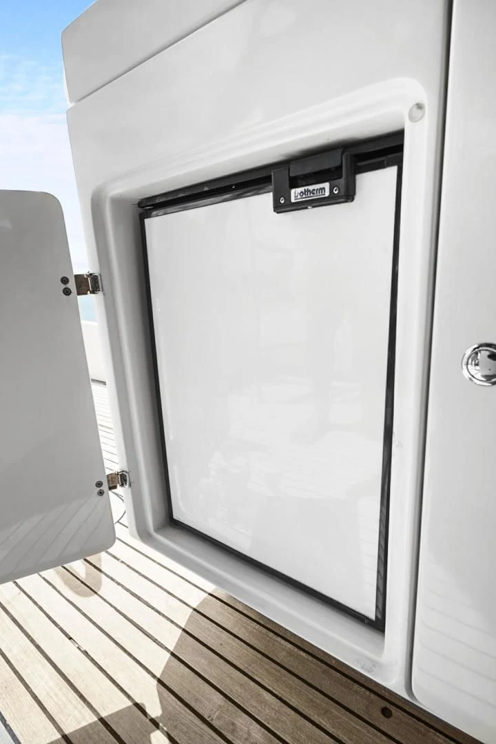 a white rectangular object on a wooden surface aboard EL PATRON Yacht for Sale