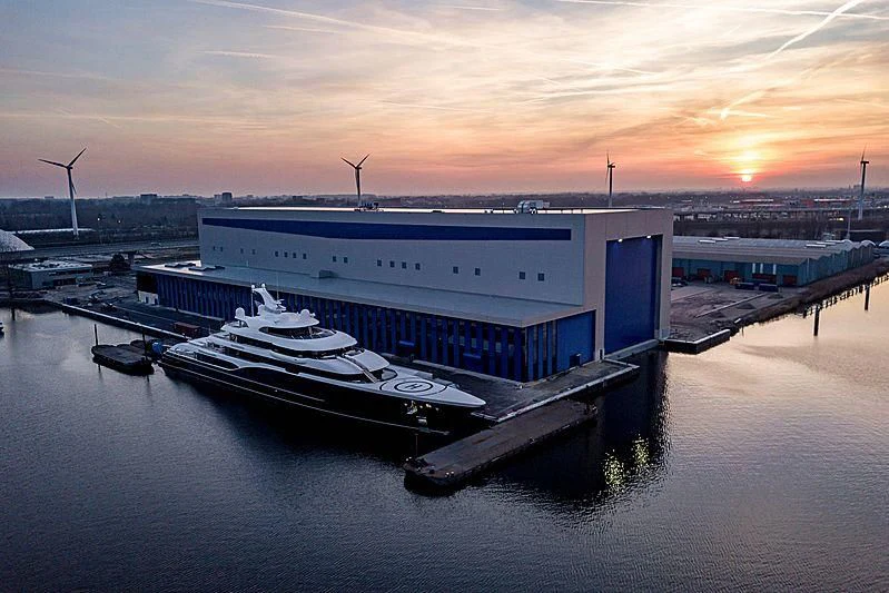 a large ship docked at a port aboard SYMPHONY Yacht for Sale