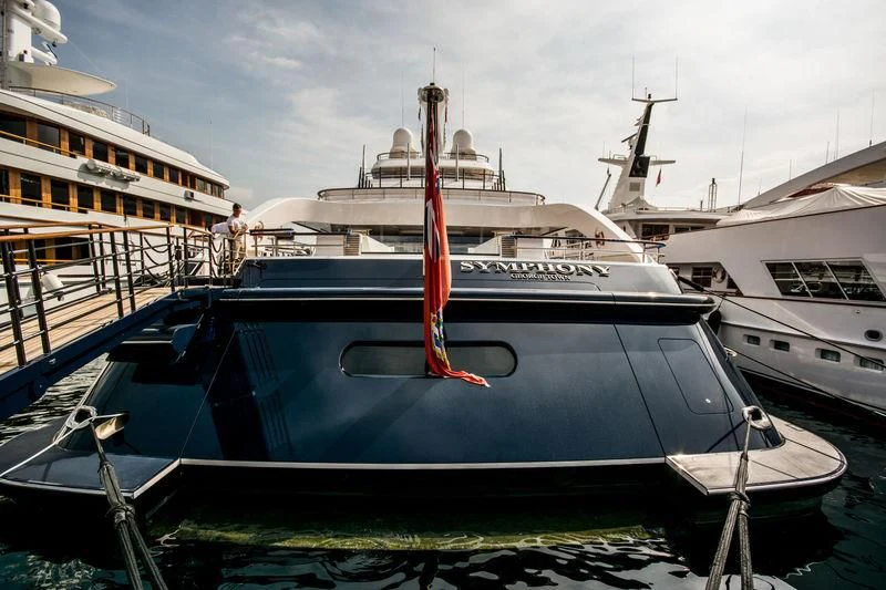 a boat docked at a pier aboard SYMPHONY Yacht for Sale
