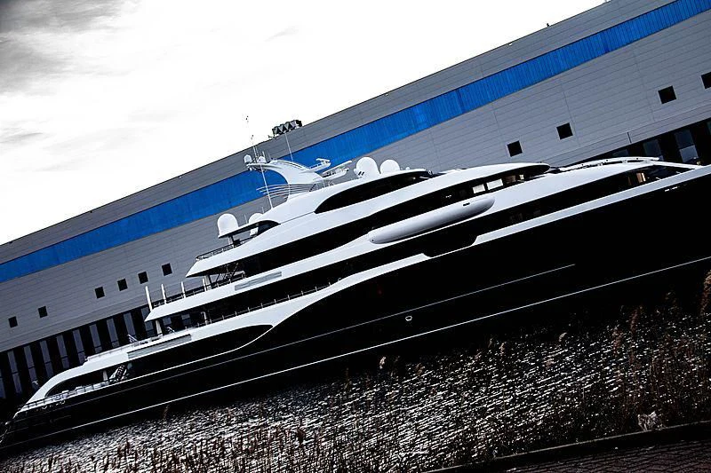 a large white boat on a beach aboard SYMPHONY Yacht for Sale