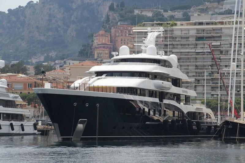 a large ship docked at a port aboard SYMPHONY Yacht for Sale