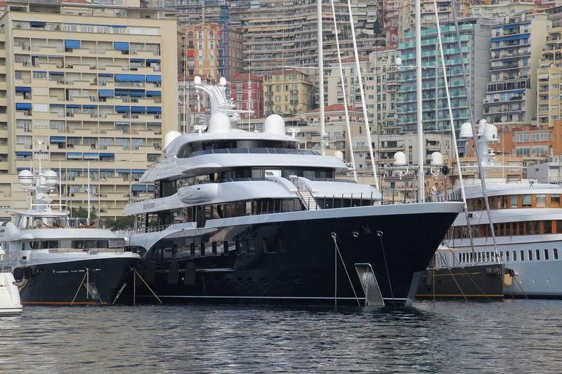 a large boat is parked in the water aboard SYMPHONY Yacht for Sale
