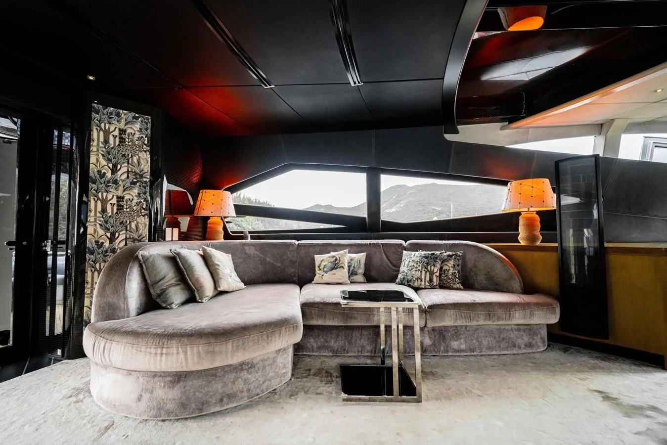 a living room with a large window aboard SORAYA Yacht for Sale