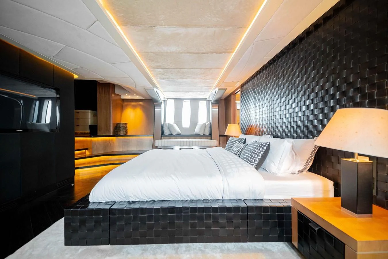 a bedroom with a bed and a desk aboard SORAYA Yacht for Sale