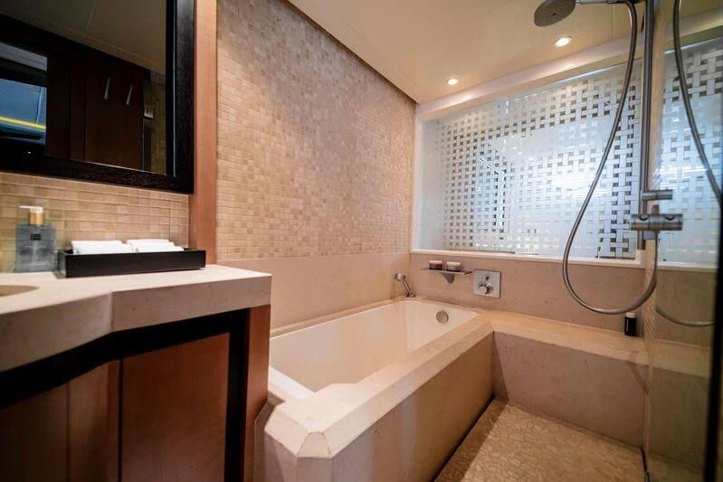 a bathroom with a tub sink and a shower aboard SORAYA Yacht for Sale