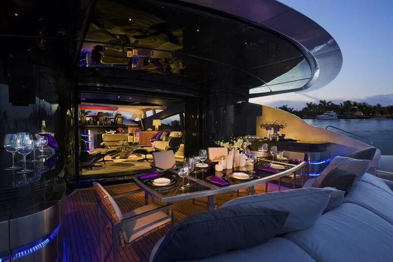 a boat with a table and chairs aboard SORAYA Yacht for Sale