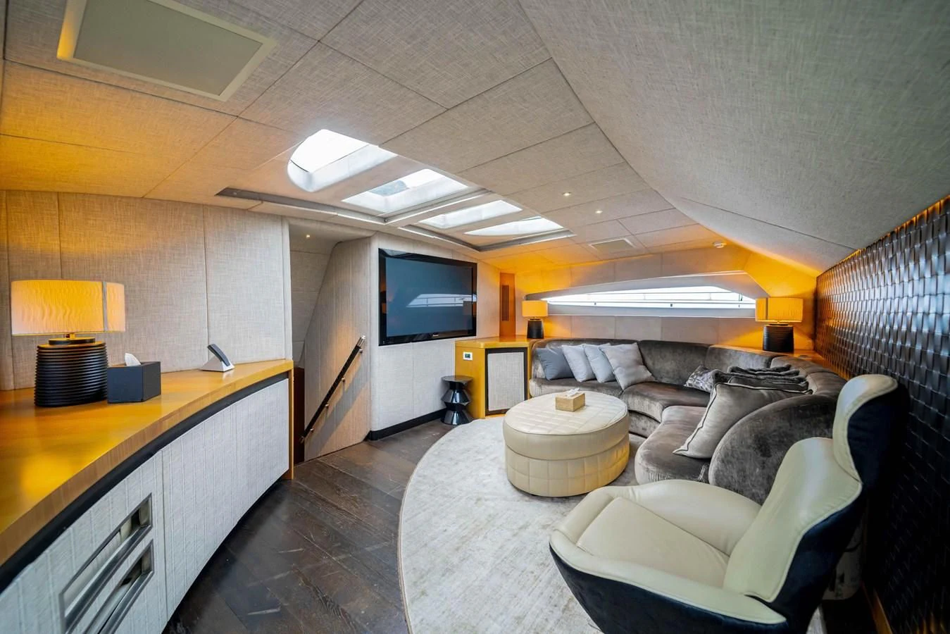 a living room with a large tv aboard SORAYA Yacht for Sale