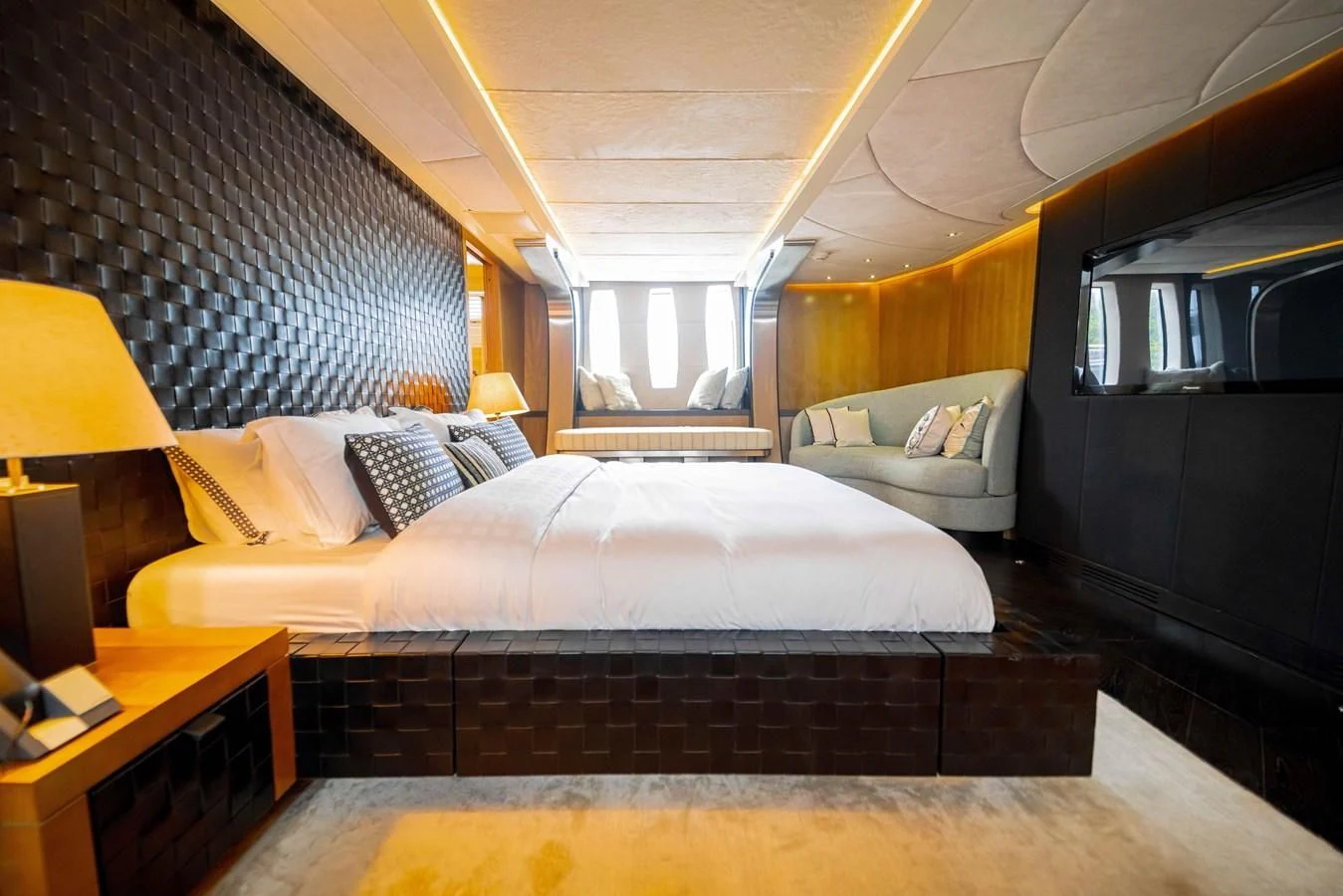 a bedroom with a bed and a couch aboard SORAYA Yacht for Sale