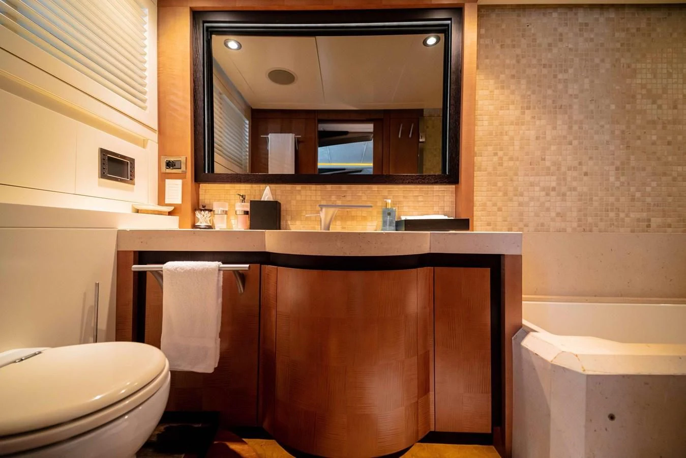 a bathroom with a mirror and a sink aboard SORAYA Yacht for Sale