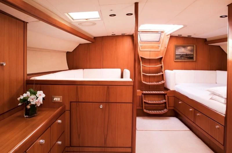 a bathroom with wooden cabinets aboard ABEON Yacht for Charter