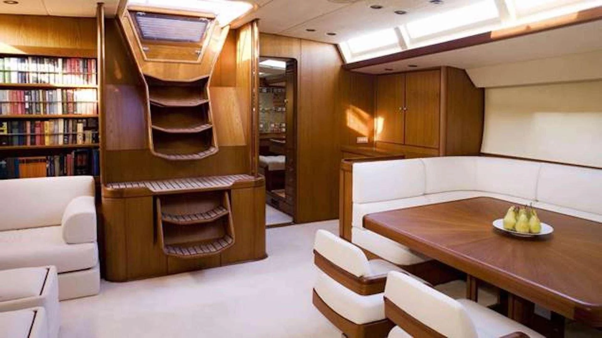a room with a table and chairs aboard ABEON Yacht for Charter