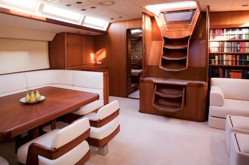 a room with a table and chairs aboard ABEON Yacht for Charter