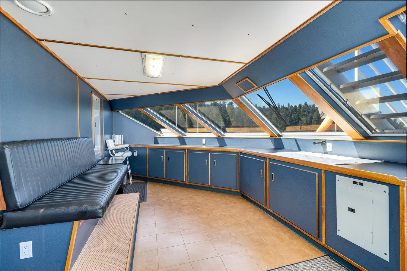 a room with a couch and a table aboard DRAGONFLY Yacht for Sale