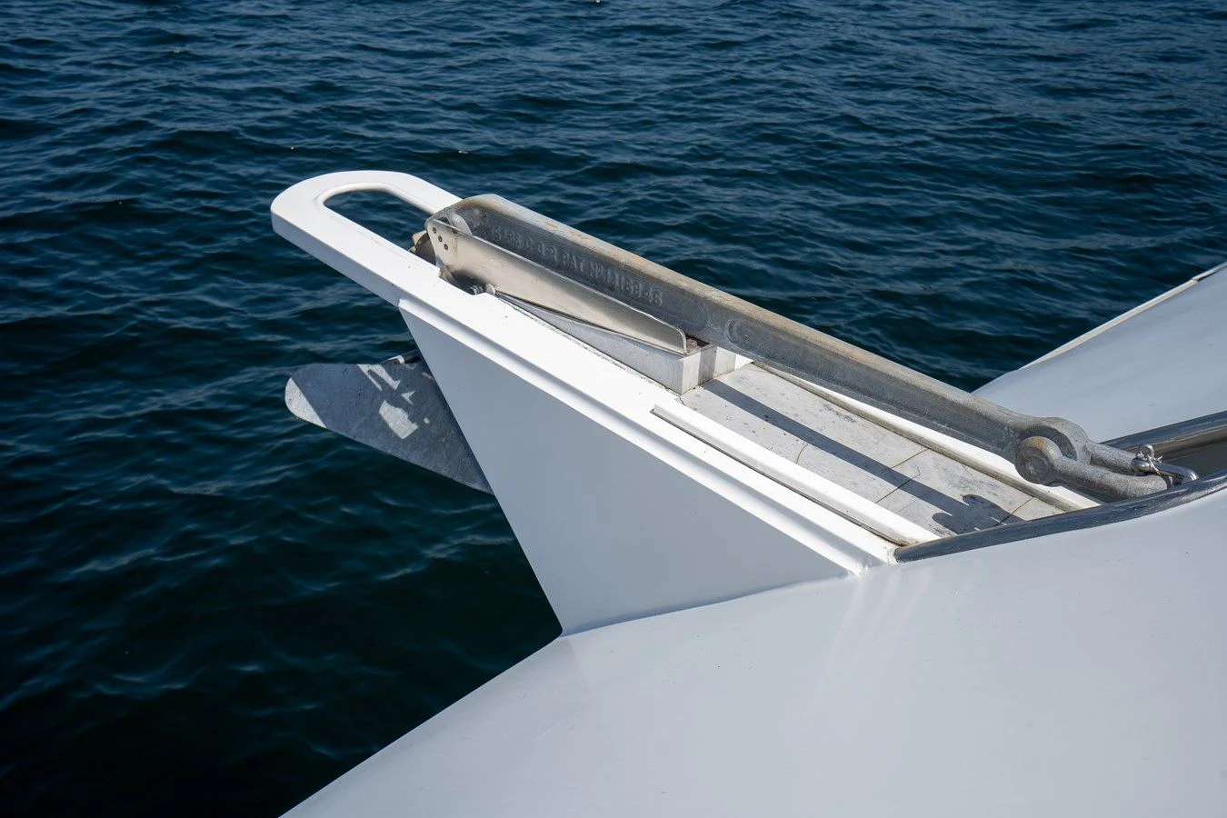 a white boat in the water aboard DRAGONFLY Yacht for Sale