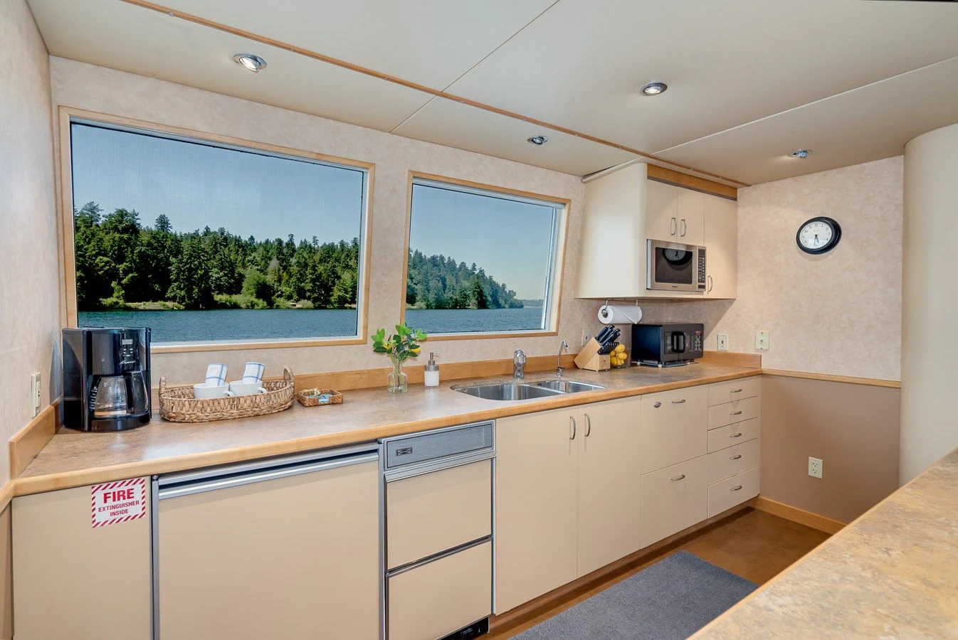 a kitchen with a large window aboard DRAGONFLY Yacht for Sale