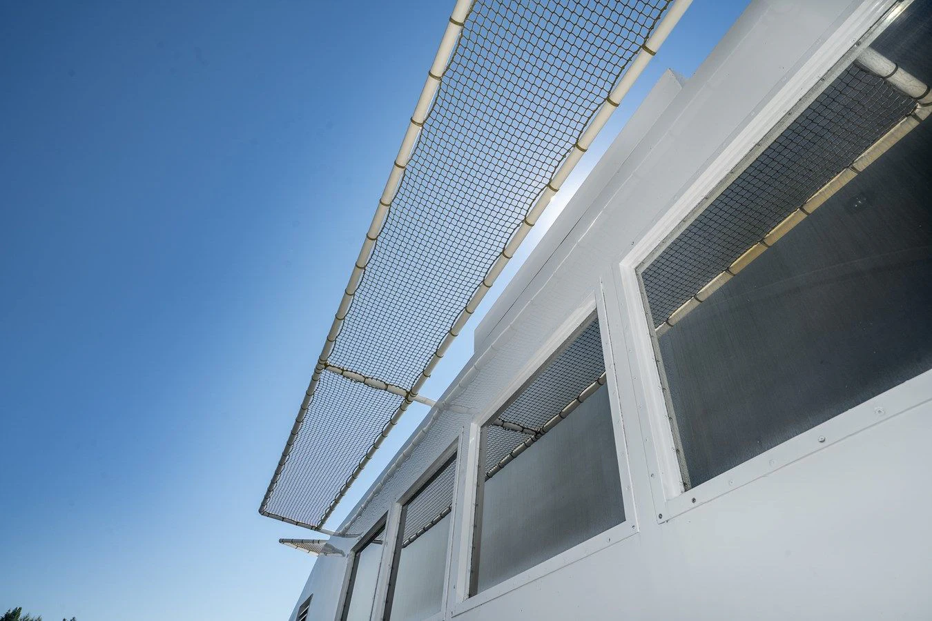 a tall building with a tall tower aboard DRAGONFLY Yacht for Sale