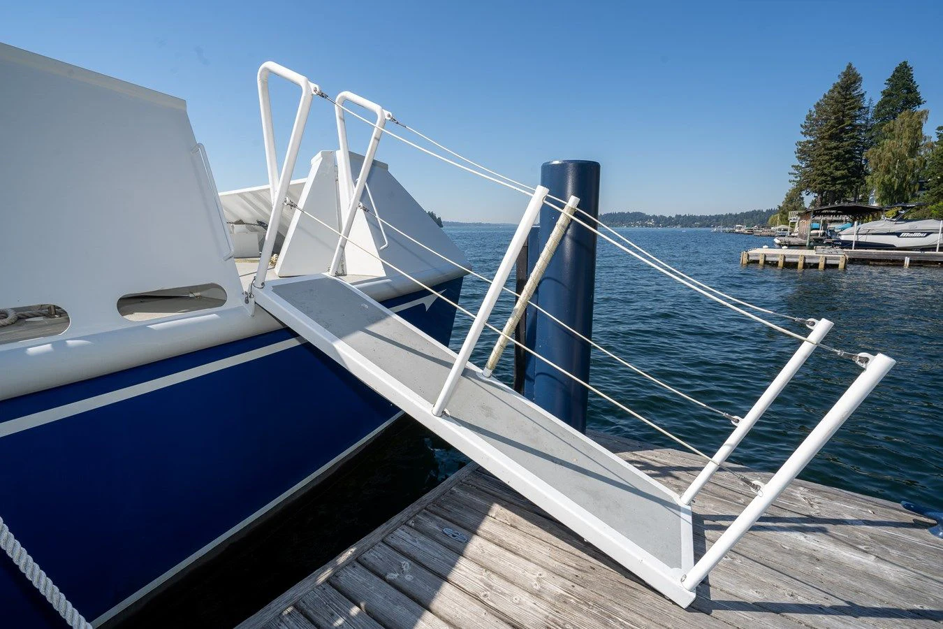 a boat tied to a dock aboard DRAGONFLY Yacht for Sale