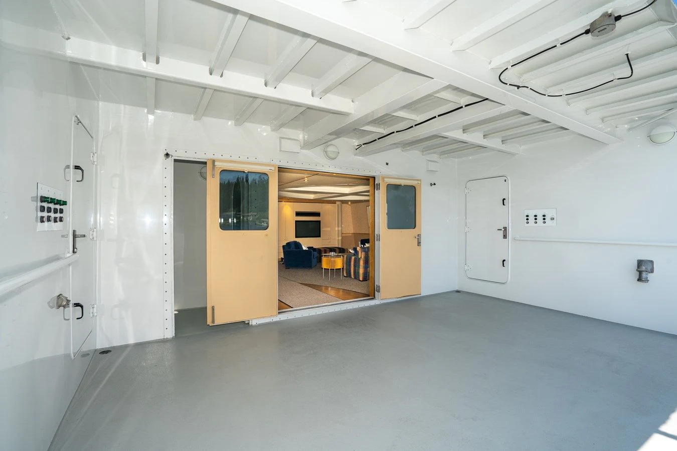 a room with a door and a window aboard DRAGONFLY Yacht for Sale