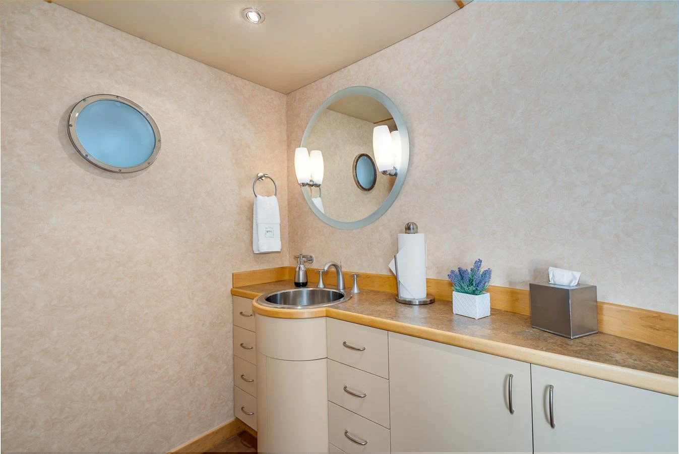 a bathroom with a sink and mirrors aboard DRAGONFLY Yacht for Sale