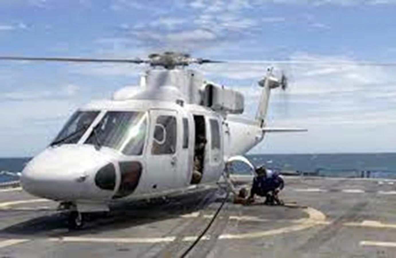 a helicopter on a runway aboard DRAGONFLY Yacht for Sale