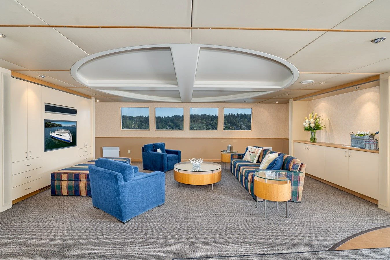 a room with a couch and a table aboard DRAGONFLY Yacht for Sale
