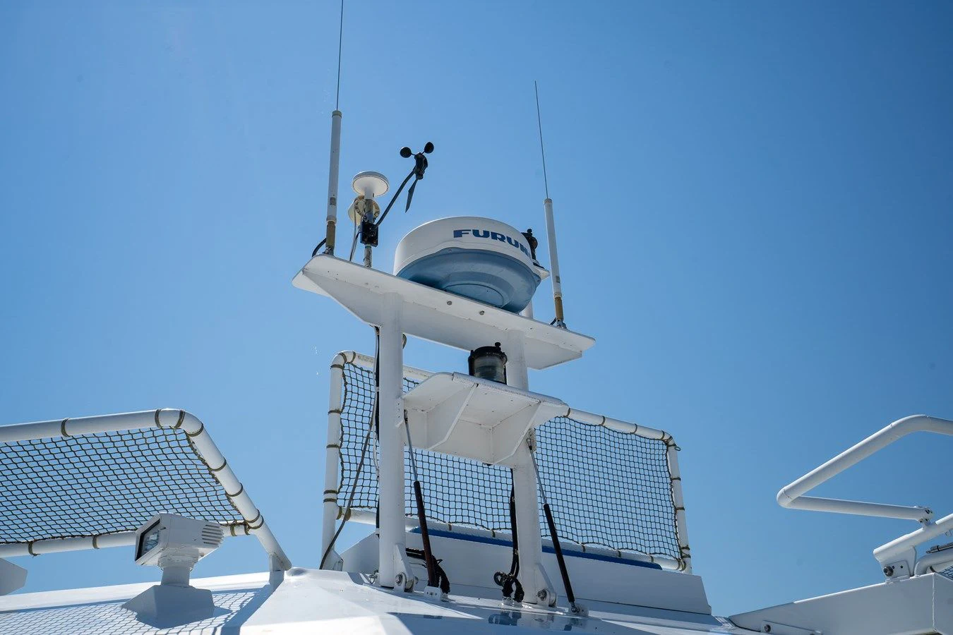 a person standing on a white tower aboard DRAGONFLY Yacht for Sale