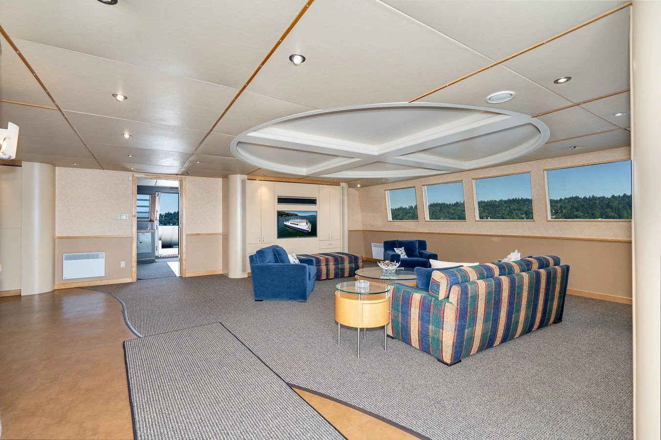 a large living room with a large open floor plan aboard DRAGONFLY Yacht for Sale