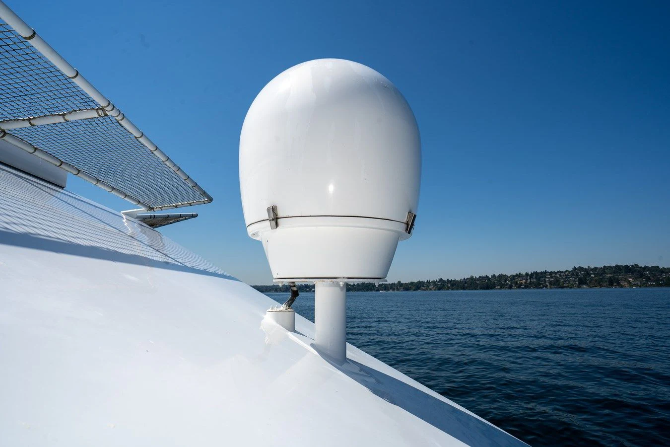a white satellite dish on a blue sky day aboard DRAGONFLY Yacht for Sale