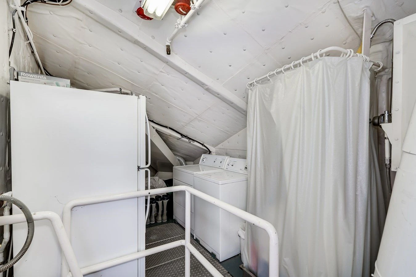 a room with white containers aboard DRAGONFLY Yacht for Sale