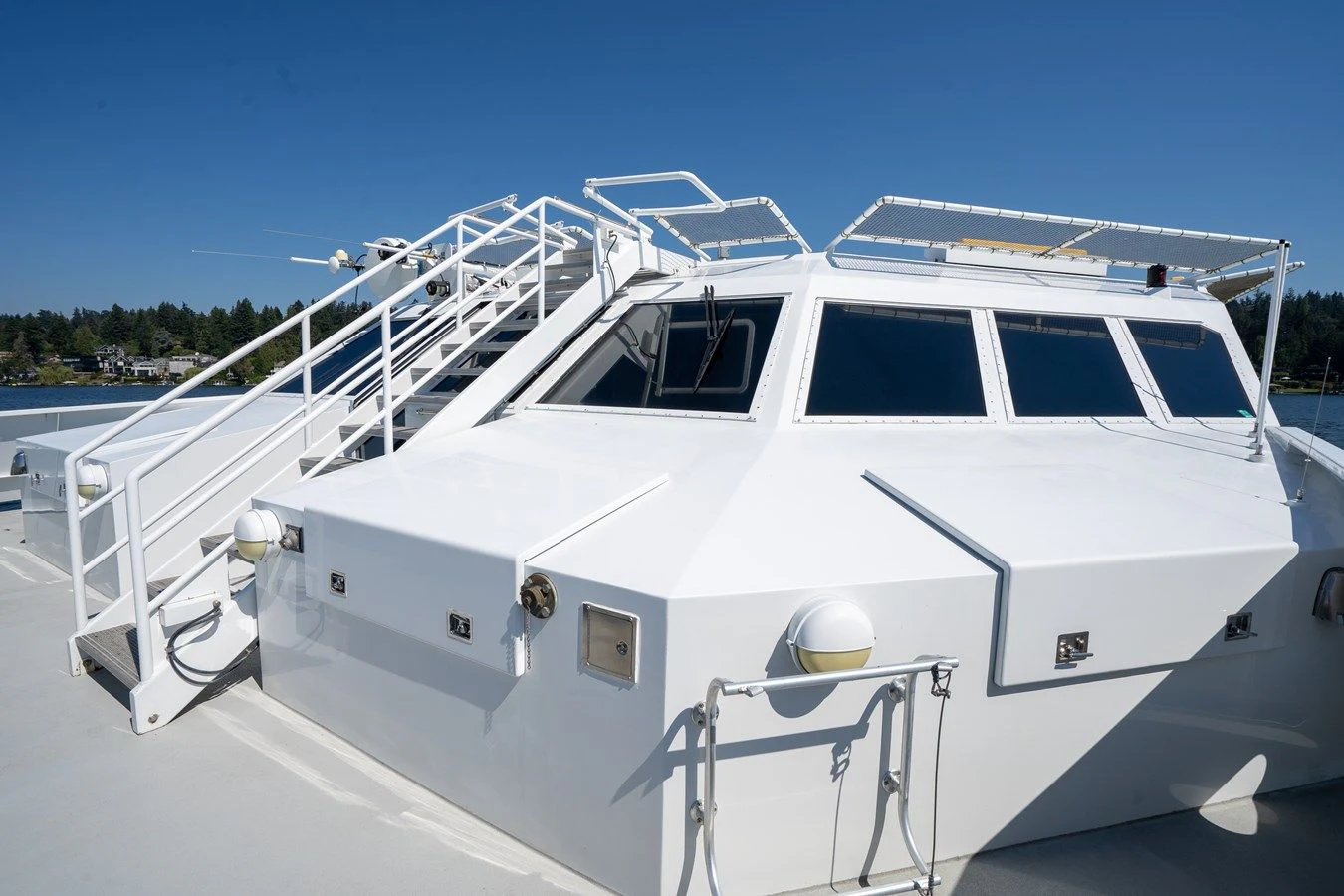 a white boat on a beach aboard DRAGONFLY Yacht for Sale