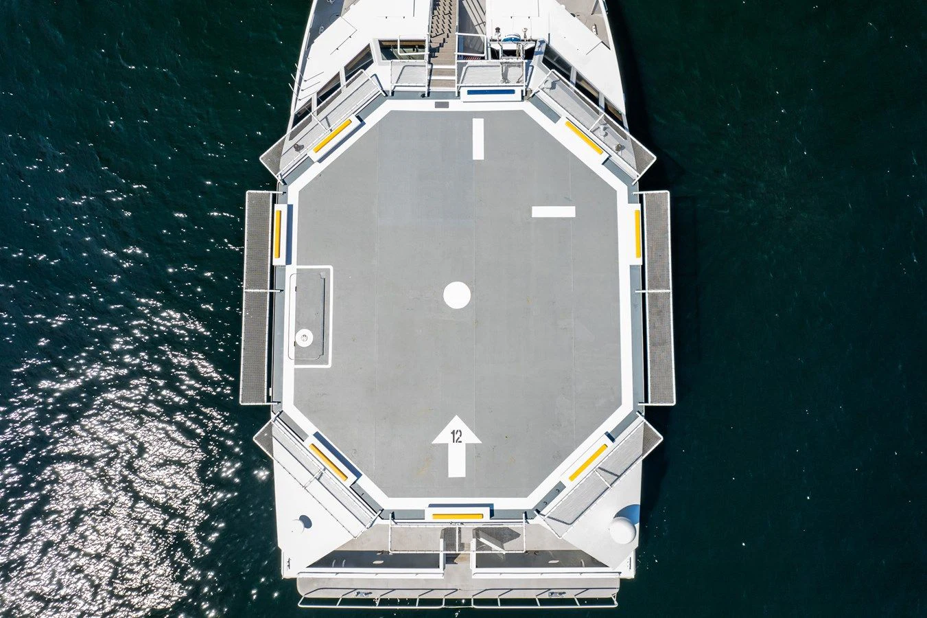 a white vehicle on a road aboard DRAGONFLY Yacht for Sale