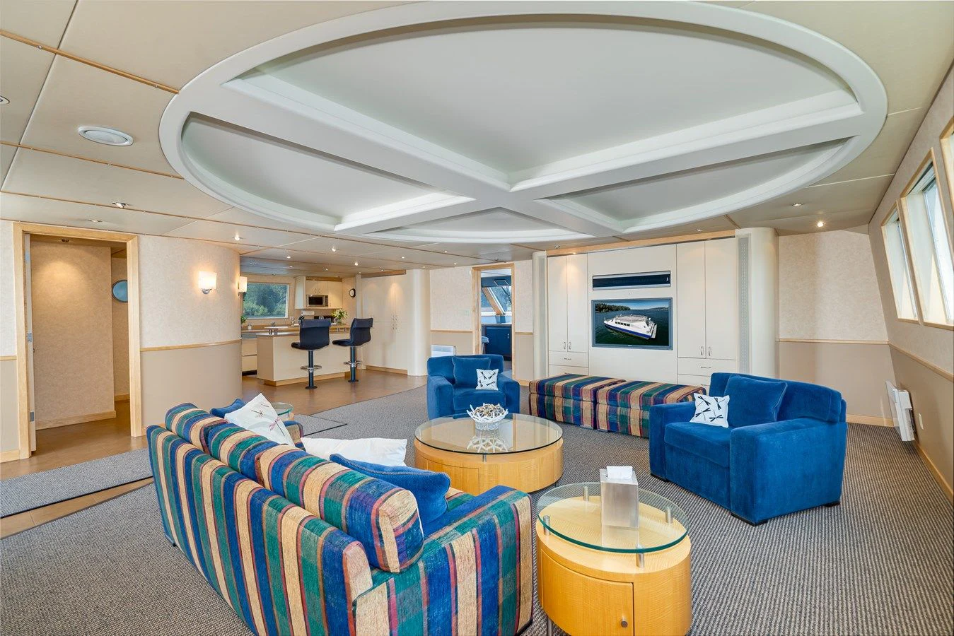 a living room with a couch and a table aboard DRAGONFLY Yacht for Sale