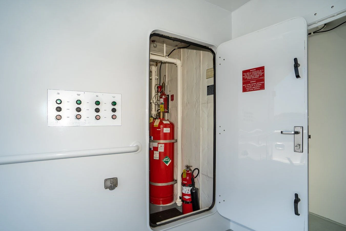 a white machine with a red and white object on the side aboard DRAGONFLY Yacht for Sale