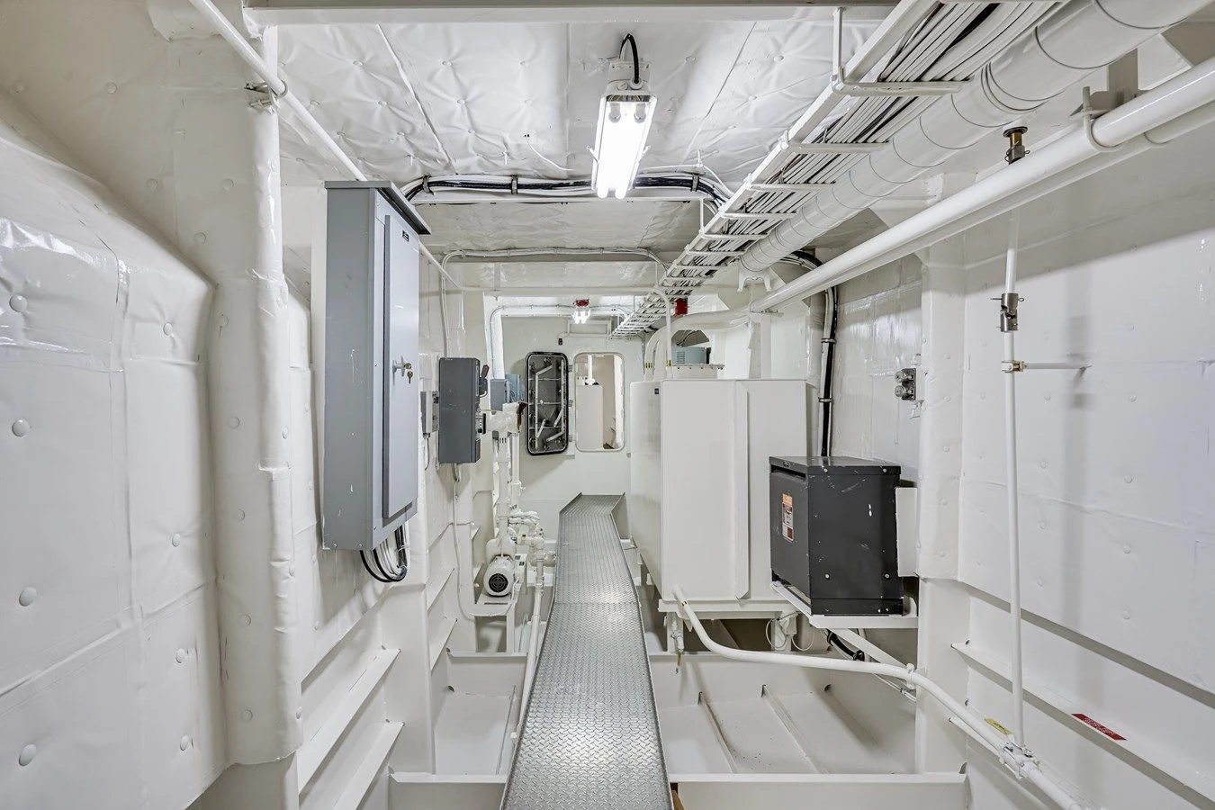 a long hallway with several doors aboard DRAGONFLY Yacht for Sale