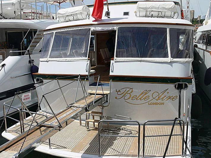 a boat with a sign on the front aboard LELOU Yacht for Sale