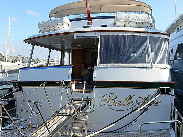 a boat is parked in a harbor aboard LELOU Yacht for Sale