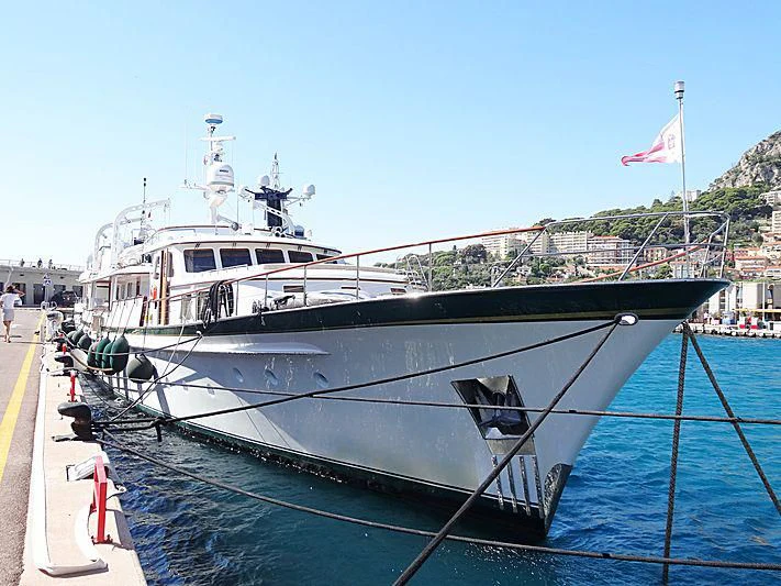 a boat docked at a pier aboard LELOU Yacht for Sale