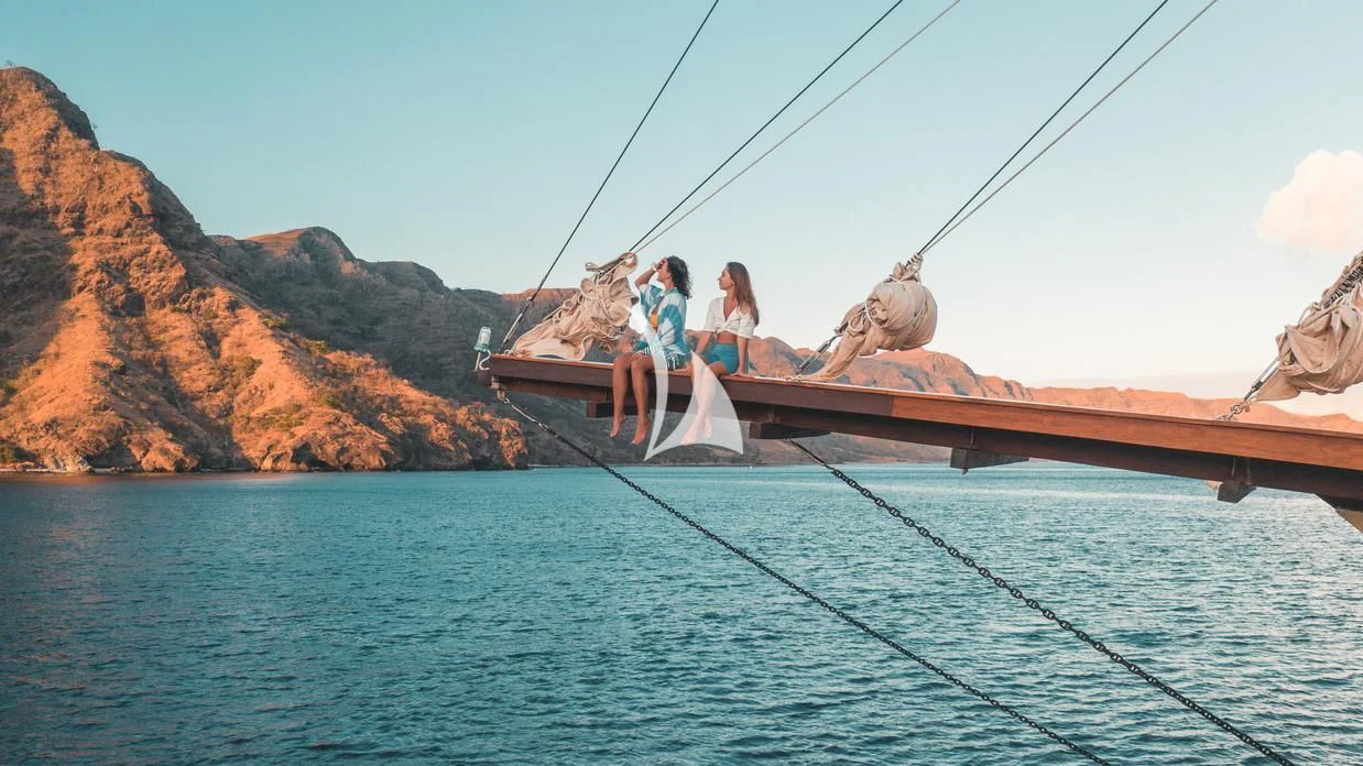 a couple of people on a boat aboard THE MAJ OCEANIC Yacht for Charter