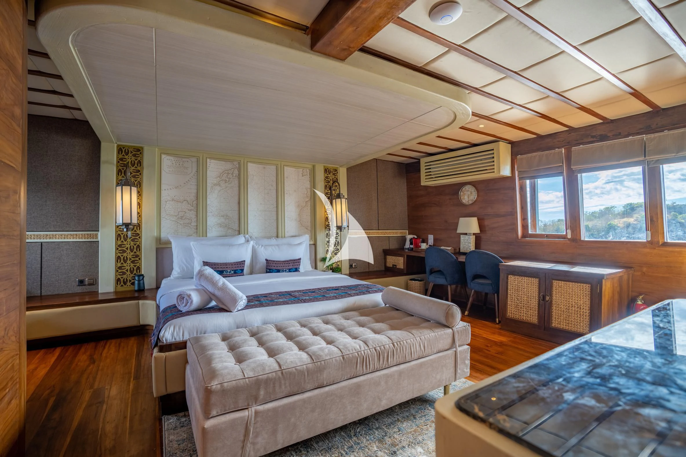 a large bedroom with a large bed aboard THE MAJ OCEANIC Yacht for Charter